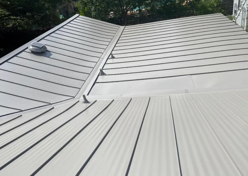 Solar attic fan installed on a metal roof for Roof Ventilation in West Columbia